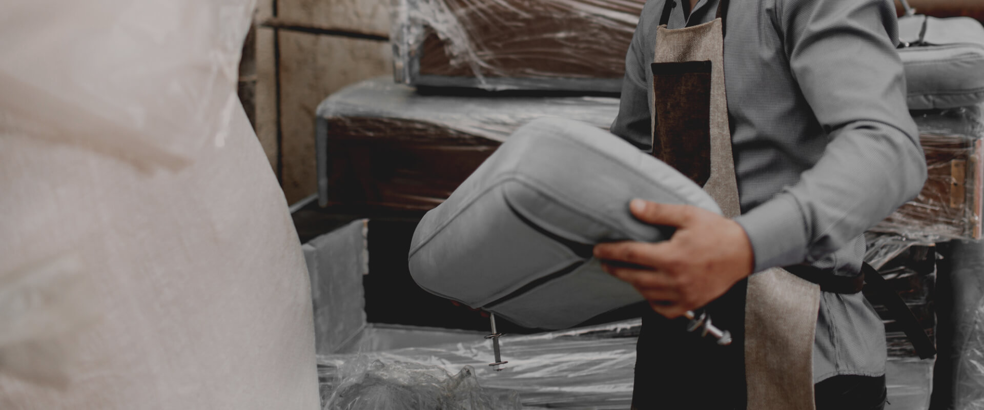 A worker assembling a piece of furniture
